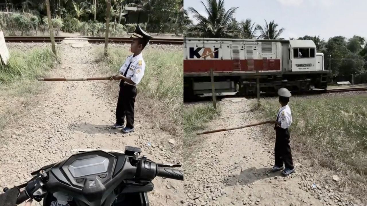 Tak Ada Palang, Anak Kecil Berpakaian Masinis Ini Halau Pemotor Pakai Kayu Seadanya Tak Ada Palang, Anak Kecil Berpakaian Masinis Ini Halau Pemotor Pakai Kayu Seadanya